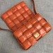 Bottega Veneta Padded Cassette Bag In Orange Calfskin