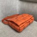 Bottega Veneta Padded Cassette Bag In Orange Calfskin